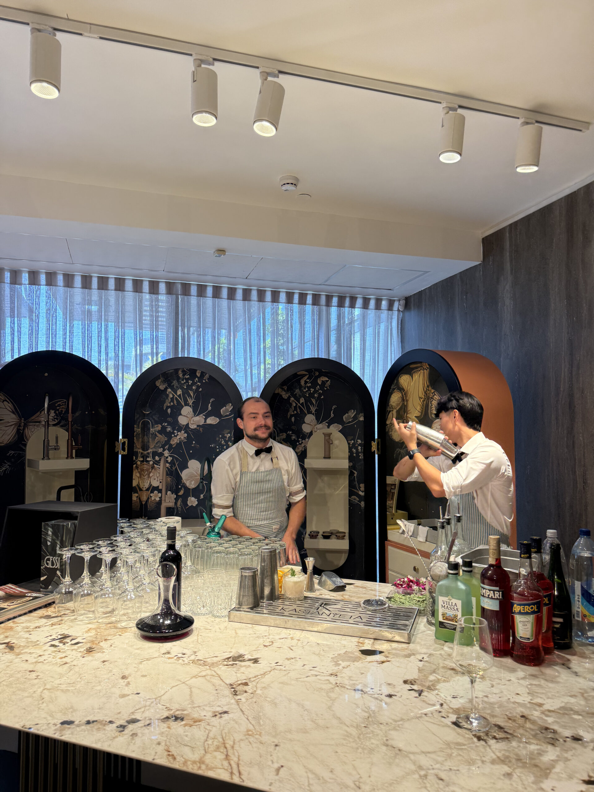 a barman shaling and another barman next to him