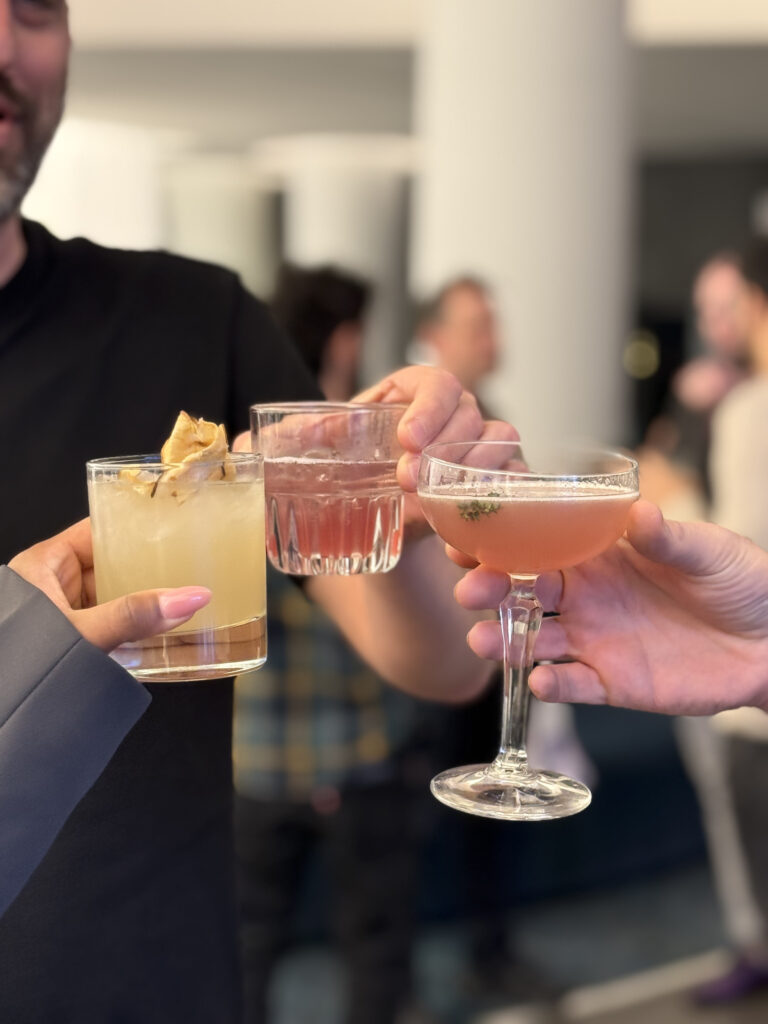 photo of people holding cocktails