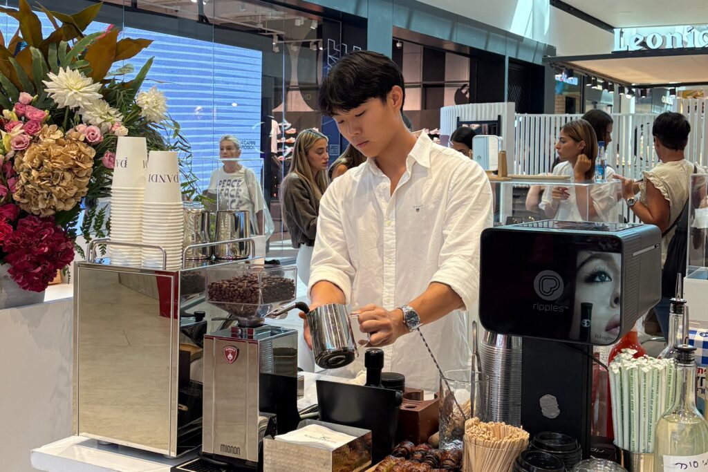 a man creating coffee
